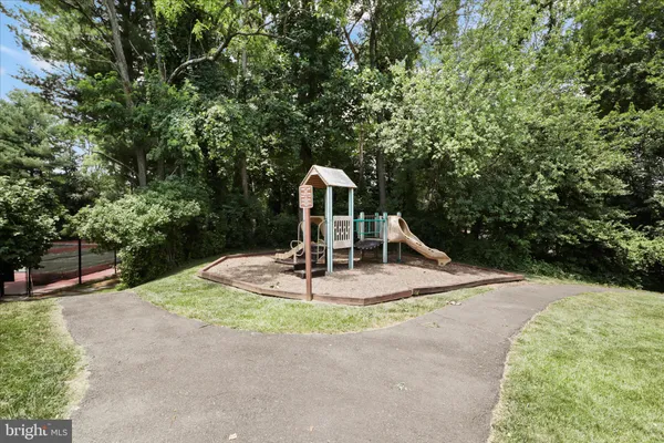 a view of a lake with houses in the back