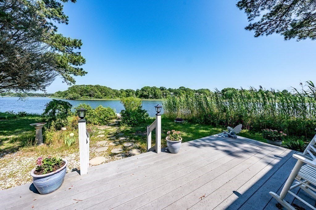 41 Aunt Debby's Road Dennis Port, MA 02639 - Photo 12 of 42 a view of a street with potted plants and large tree