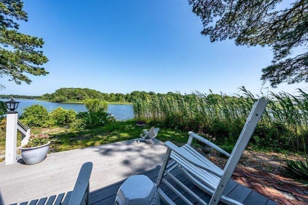 41 Aunt Debby's Road Dennis Port, MA 02639 - Photo 14 of 42 a view of a chairs and table in the backyard
