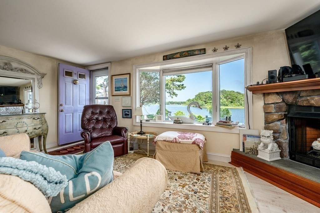 41 Aunt Debby's Road Dennis Port, MA 02639 - Photo 19 of 42 a living room with furniture and a fireplace