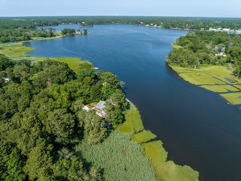 41 Aunt Debby's Road Dennis Port, MA 02639 - Photo 2 of 42 a view of a lake with a mountain in the background
