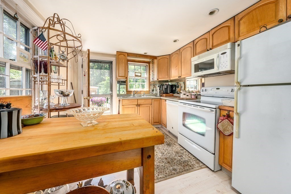 41 Aunt Debby's Road Dennis Port, MA 02639 - Photo 25 of 42 a kitchen with stainless steel appliances a stove a sink and a refrigerator