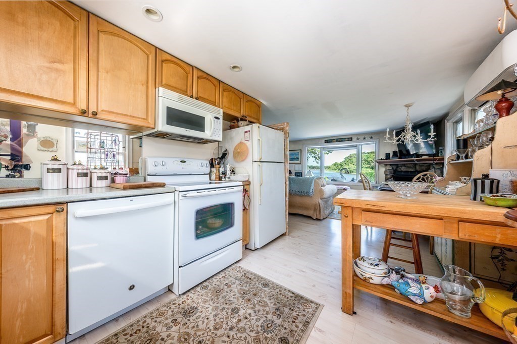 41 Aunt Debby's Road Dennis Port, MA 02639 - Photo 27 of 42 a kitchen with a white stove top oven and a refrigerator