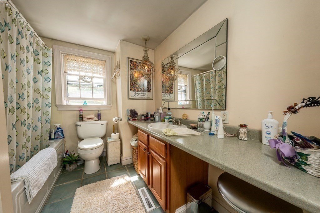 41 Aunt Debby's Road Dennis Port, MA 02639 - Photo 32 of 42 a bathroom with a double vanity sink toilet and a tub