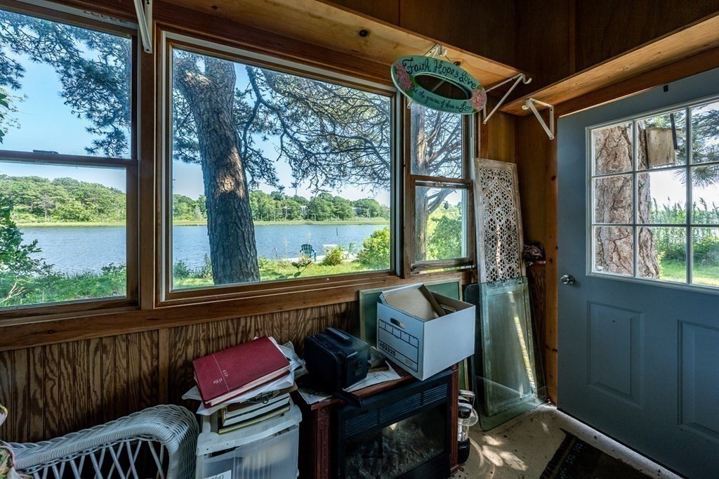 41 Aunt Debby's Road Dennis Port, MA 02639 - Photo 39 of 42 a living room with furniture and a floor to ceiling window