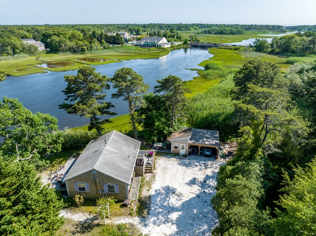 41 Aunt Debby's Road Dennis Port, MA 02639 - Photo 41 of 42 a view of a lake with a house in the background