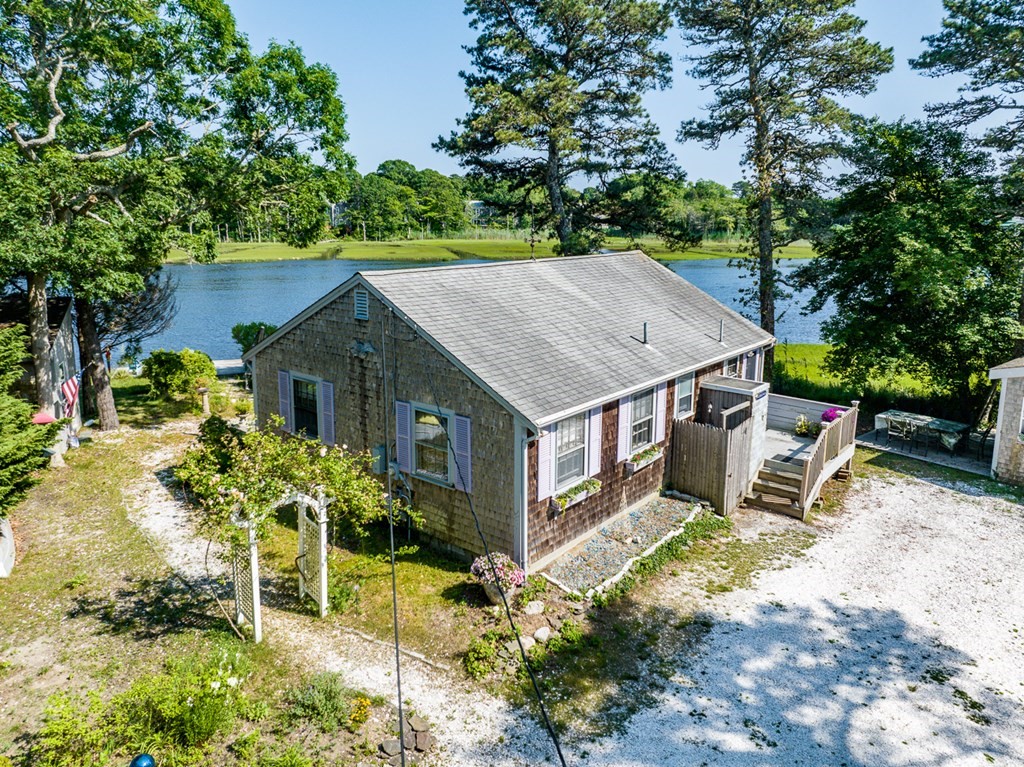 41 Aunt Debby's Road Dennis Port, MA 02639 - Photo 42 of 42 an aerial view of a house with a yard and sitting area
