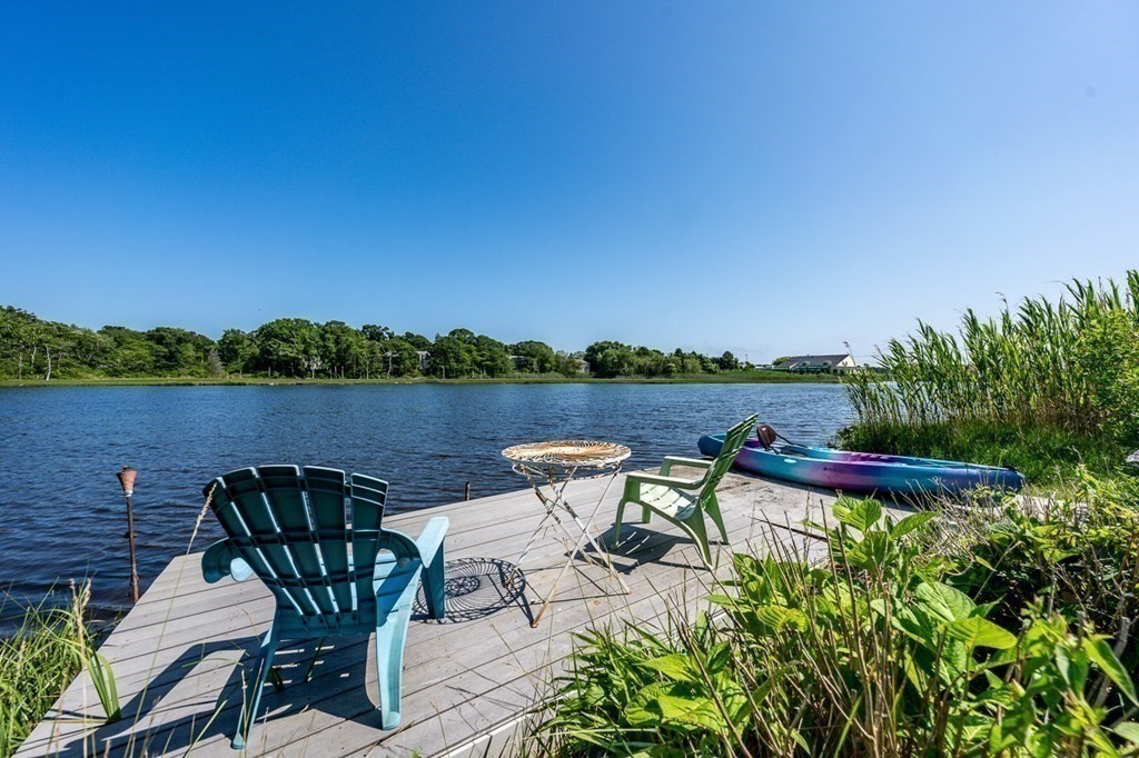 41 Aunt Debby's Road Dennis Port, MA 02639 - Photo 8 of 42 a view of a chairs and table on the terrace