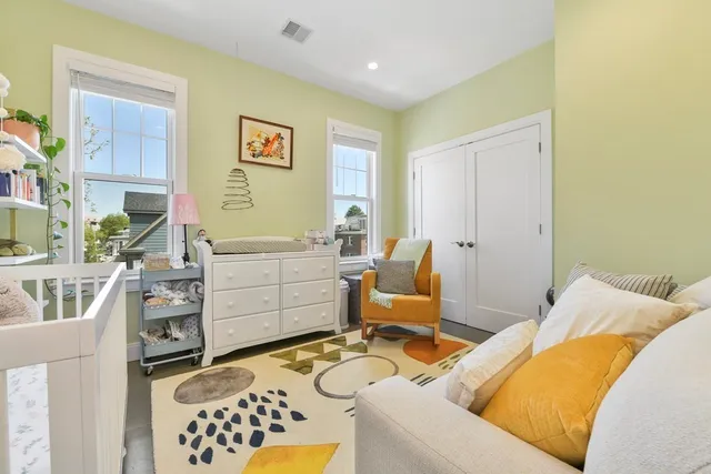 a bed room with a bed and furniture