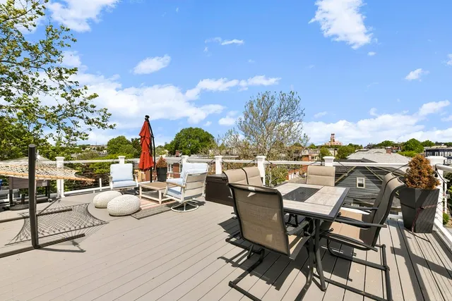 a view of a terrace with furniture and a table