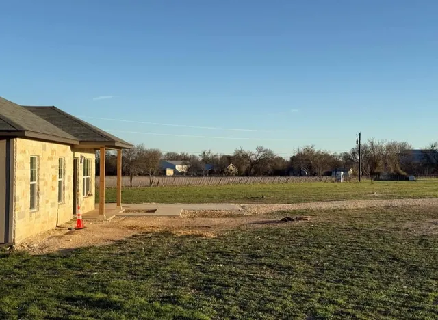 a view of a lake with a yard