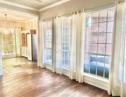 a view of entryway with wooden floor and glass door