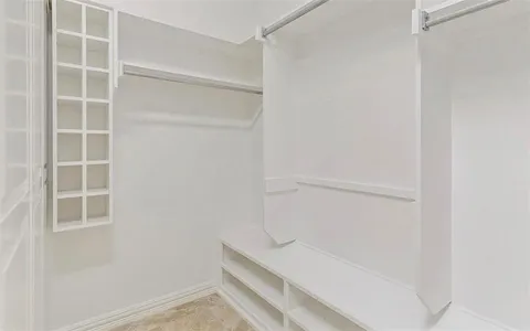 a view of an empty walk in closet
