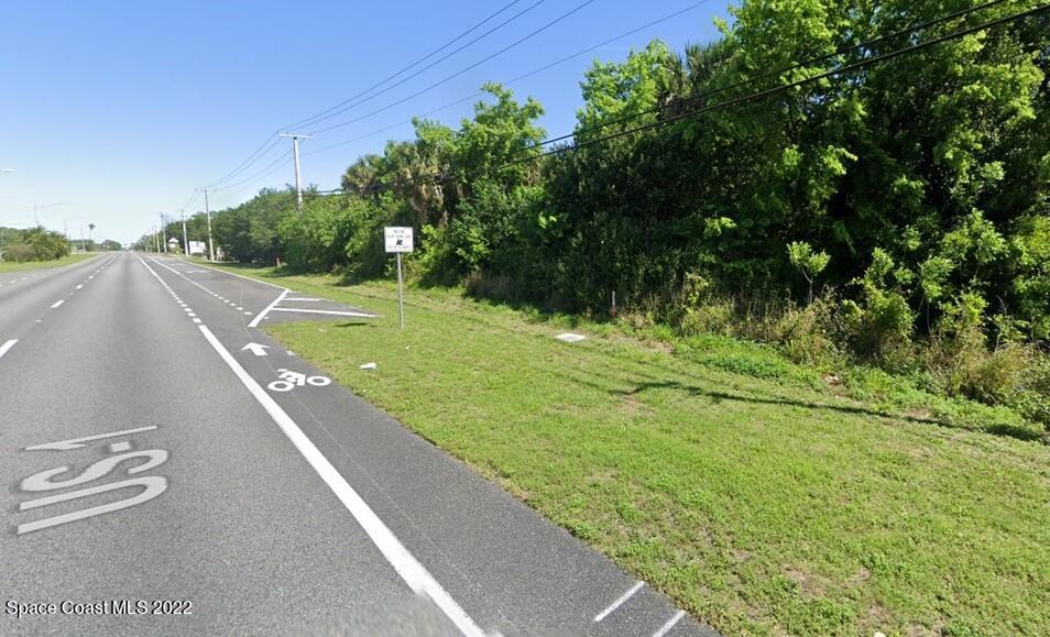 0 Buffalo Road Titusville, FL 32796 - Photo 5 of 5 a view of a street with a yard