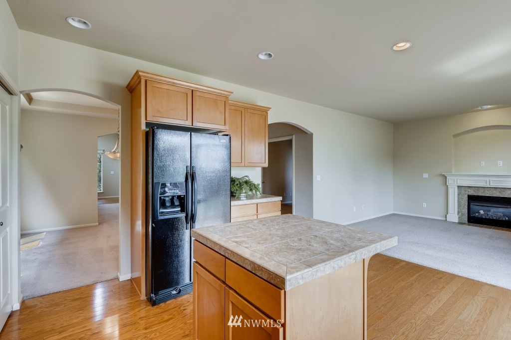614 195th Street Southeast Bothell, WA 98012 - Photo 14 of 33 a kitchen with stainless steel appliances granite countertop a refrigerator and a sink