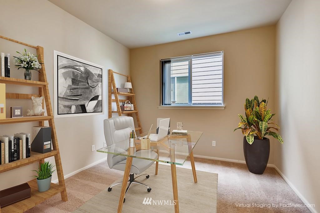 614 195th Street Southeast Bothell, WA 98012 - Photo 3 of 33 a view of a dining room with furniture and a potted plant