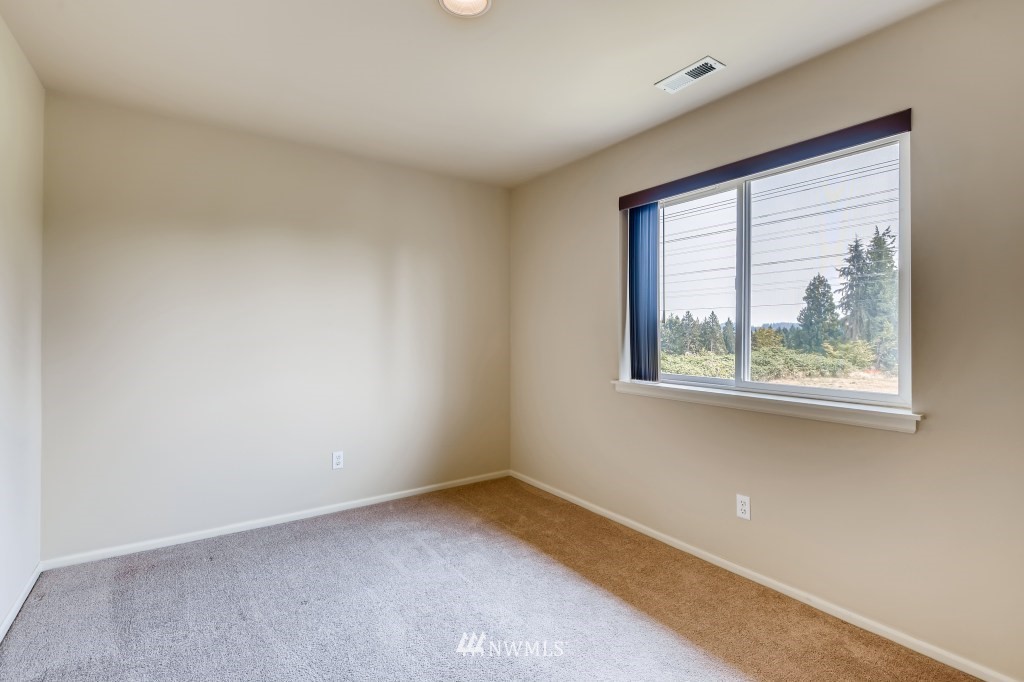 614 195th Street Southeast Bothell, WA 98012 - Photo 22 of 33 an empty room with a window