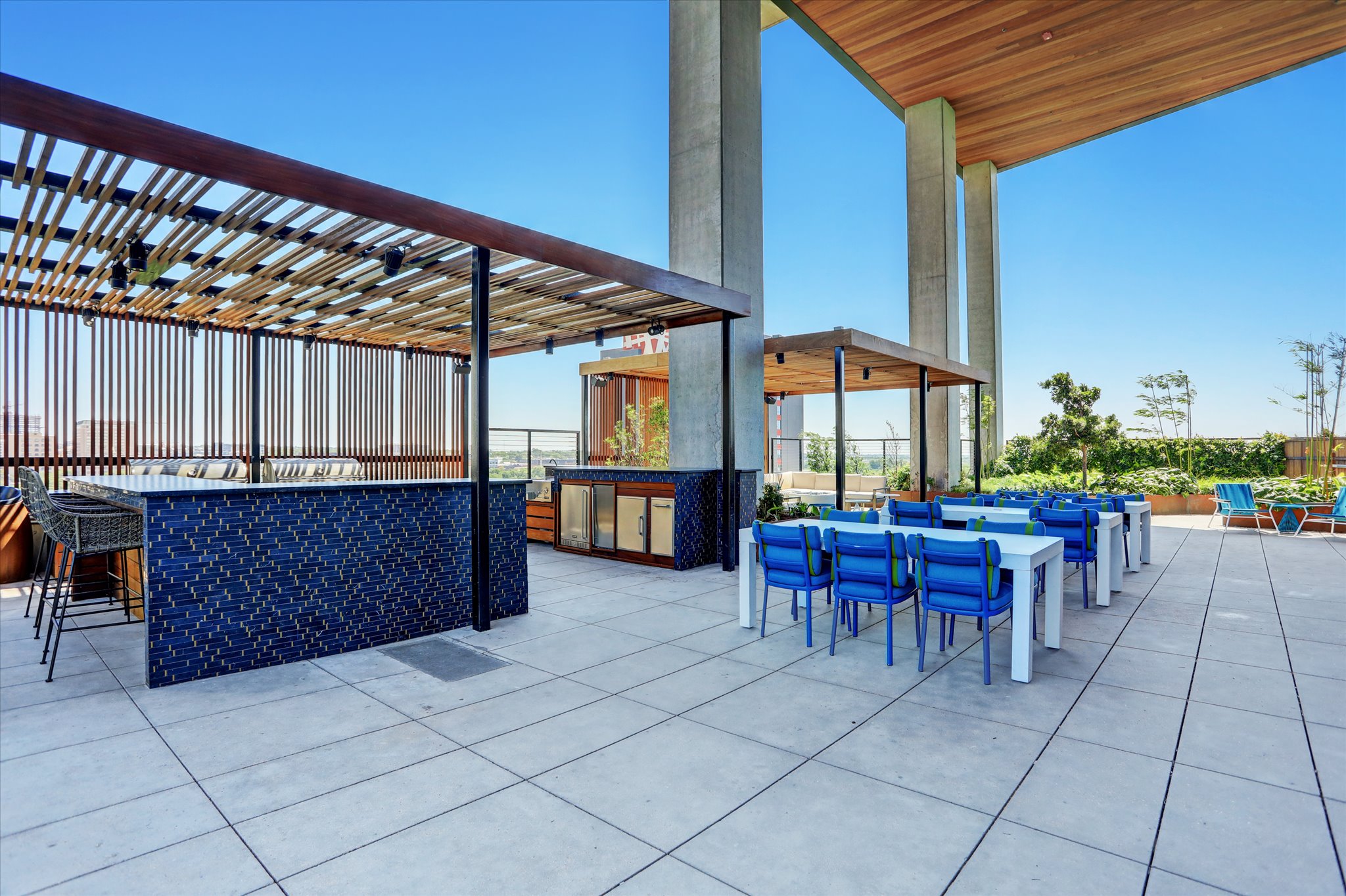 70 Rainey Street, Unit 1405 Austin, TX 78701 - Photo 23 of 31 a view of a patio with a table and chairs