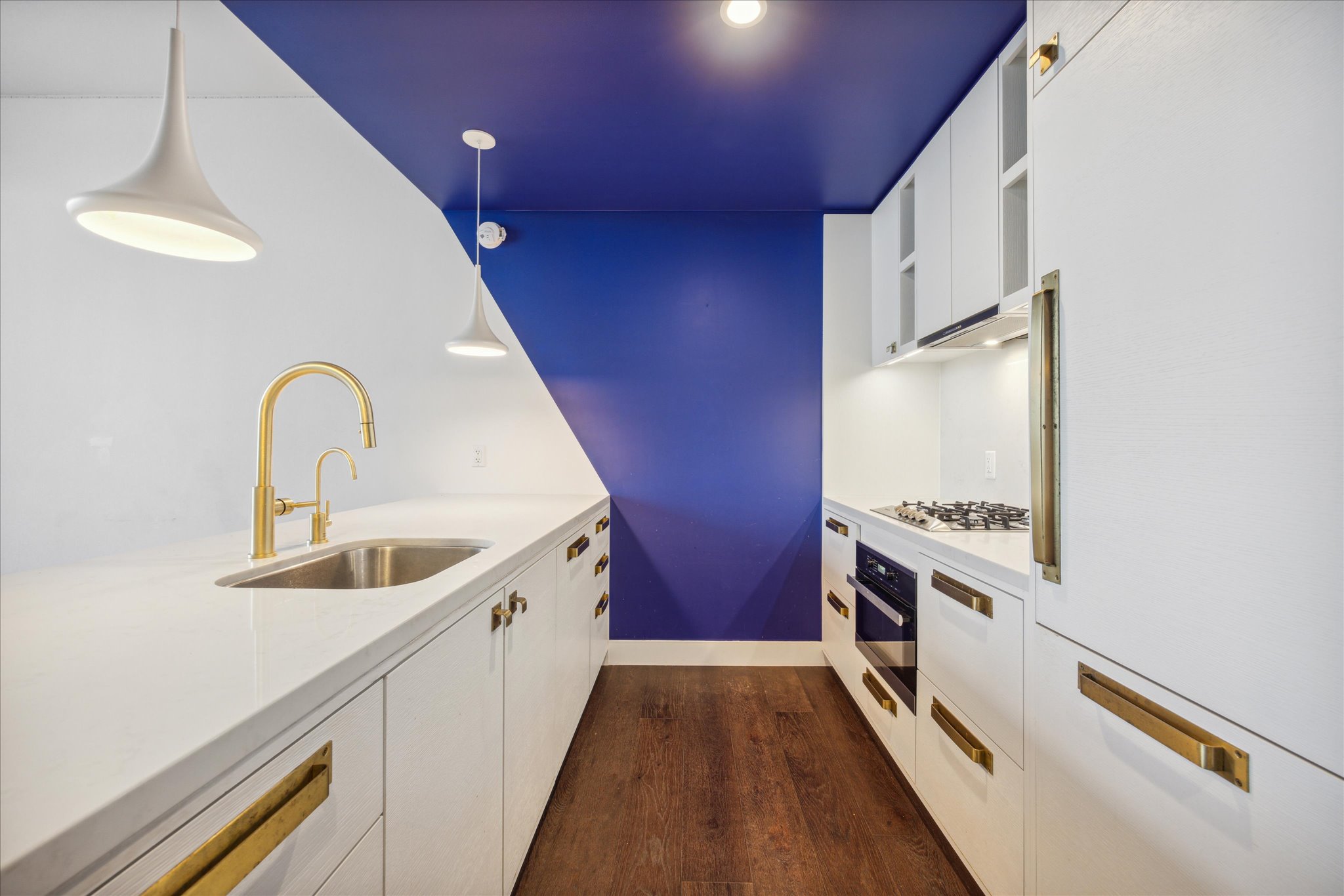 70 Rainey Street, Unit 1405 Austin, TX 78701 - Photo 3 of 31 a kitchen with sink a stove and refrigerator