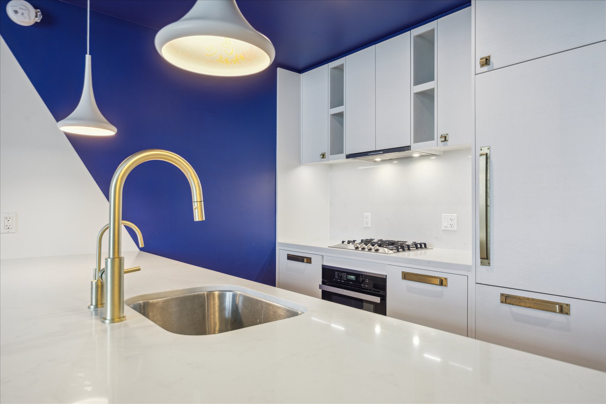 70 Rainey Street, Unit 1405 Austin, TX 78701 - Photo 5 of 31 a kitchen with stainless steel appliances granite countertop a sink and cabinets