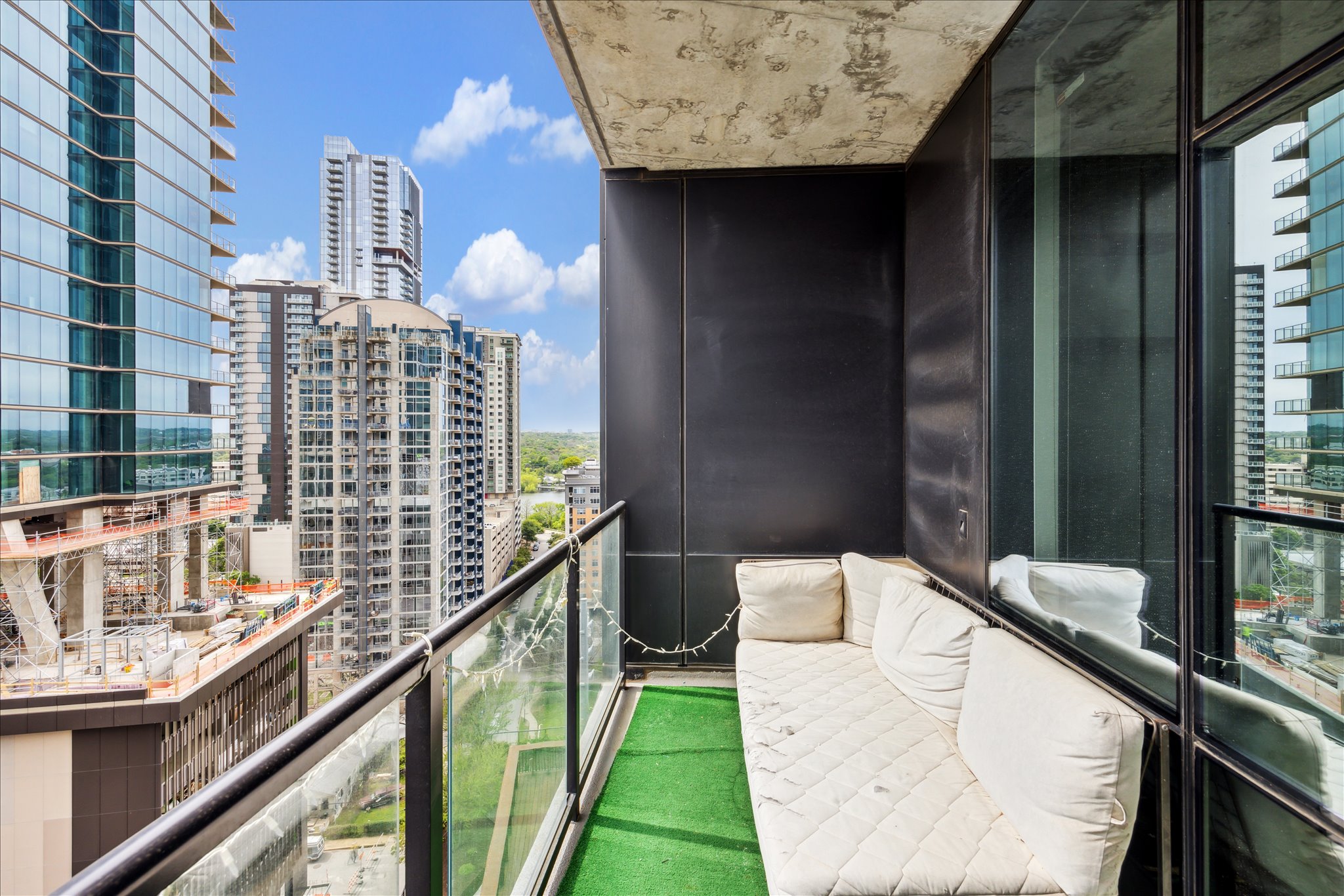 70 Rainey Street, Unit 1405 Austin, TX 78701 - Photo 8 of 31 a balcony view with a sink and wooden floor