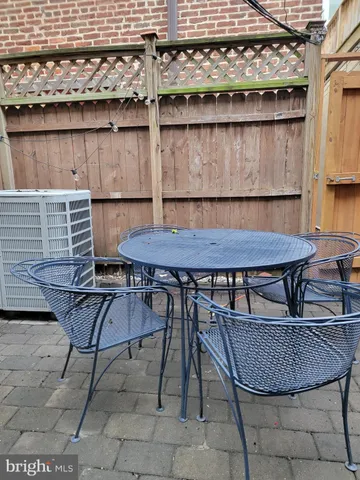 a table and chairs in a patio