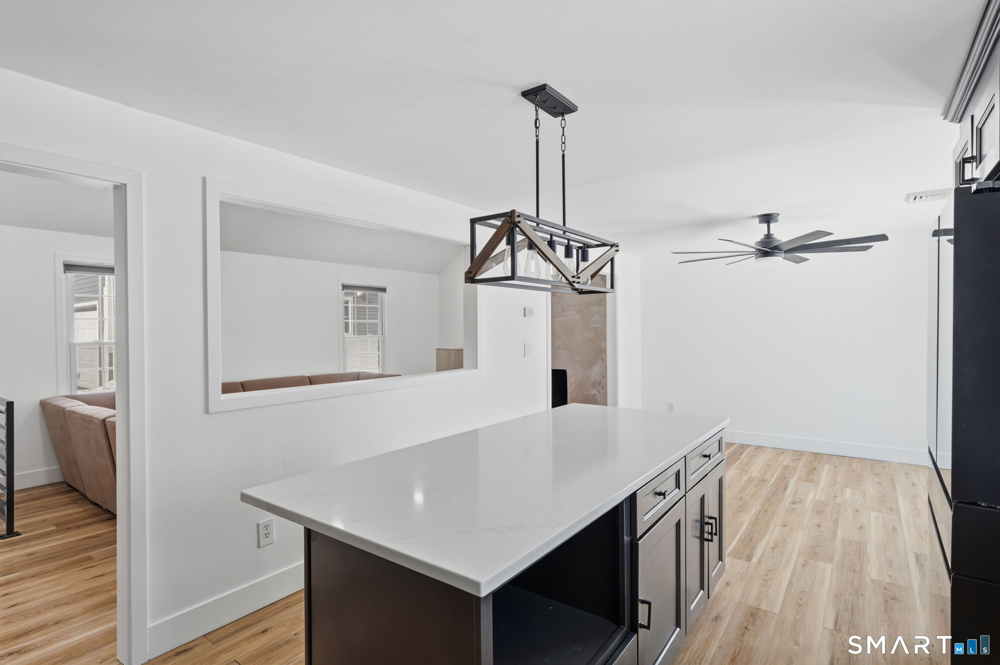 2 Yellow Orange Circle Middletown, CT 06457 - Photo 12 of 39 a view of a hallway with a kitchen and chandelier