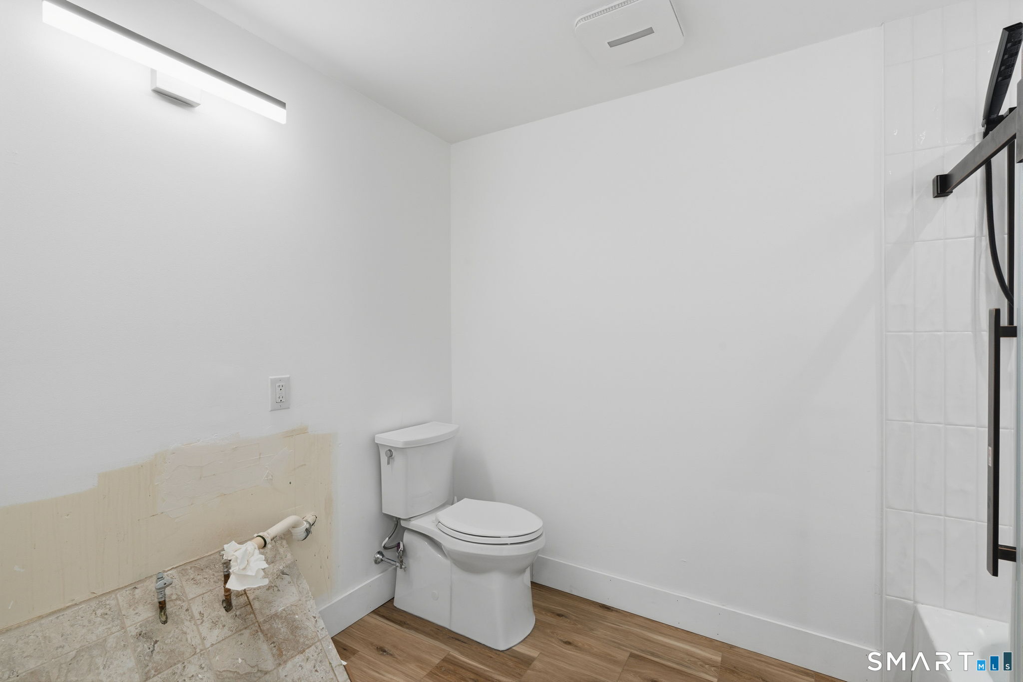 2 Yellow Orange Circle Middletown, CT 06457 - Photo 13 of 39 a white toilet sitting next to a white sink and vanity