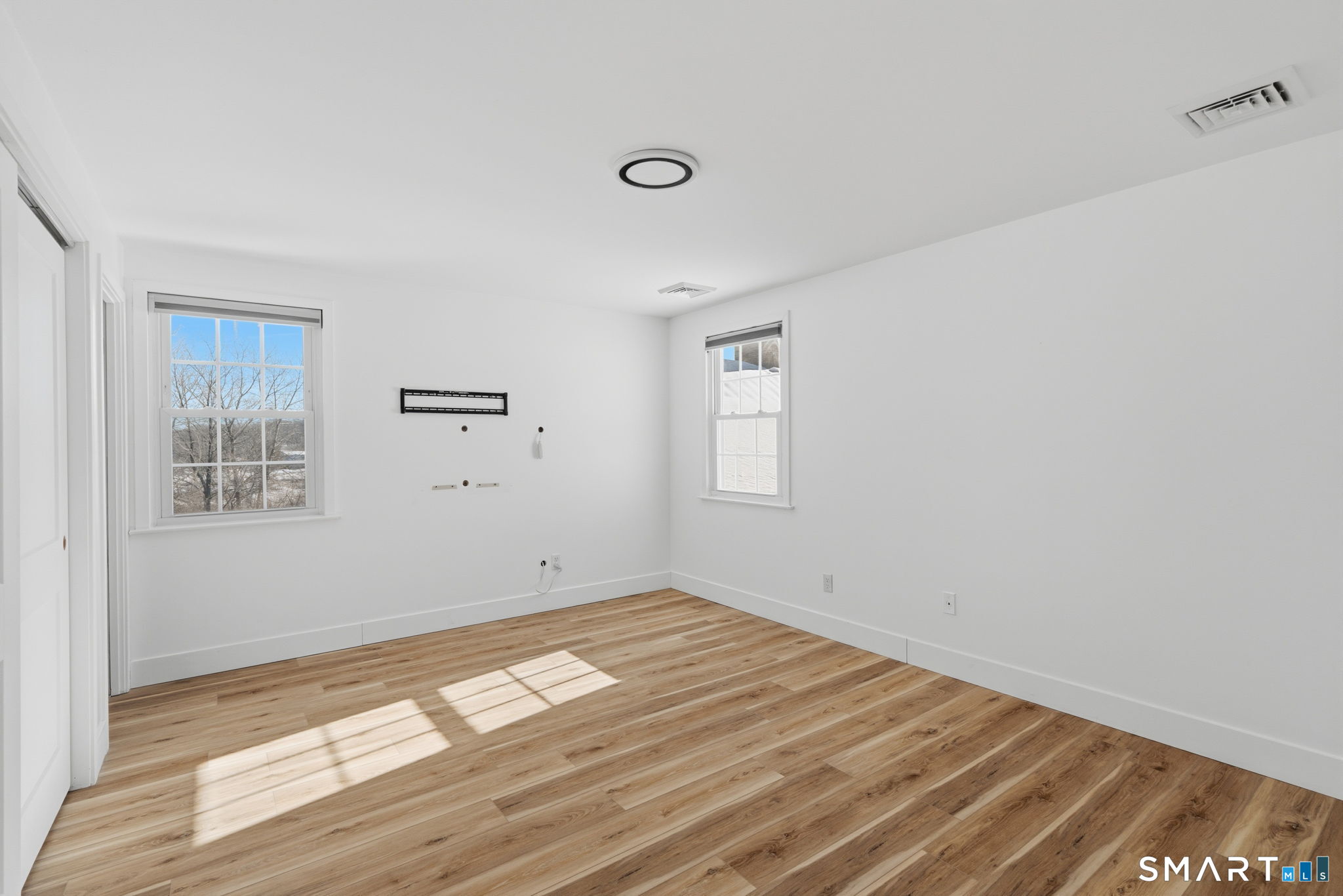 2 Yellow Orange Circle Middletown, CT 06457 - Photo 16 of 39 a view of empty room with wooden floor and fan