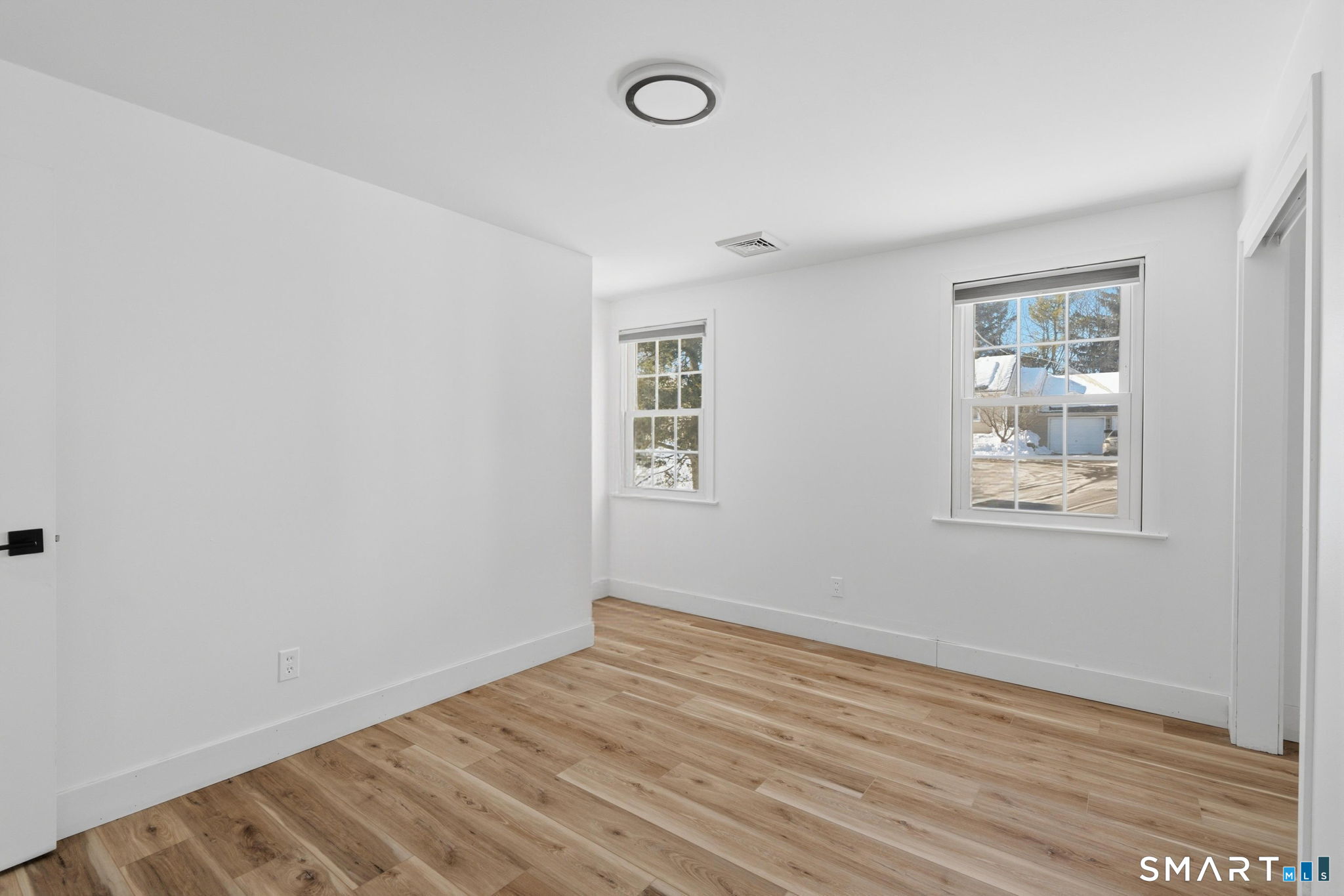 2 Yellow Orange Circle Middletown, CT 06457 - Photo 21 of 39 an empty room with wooden floor and windows
