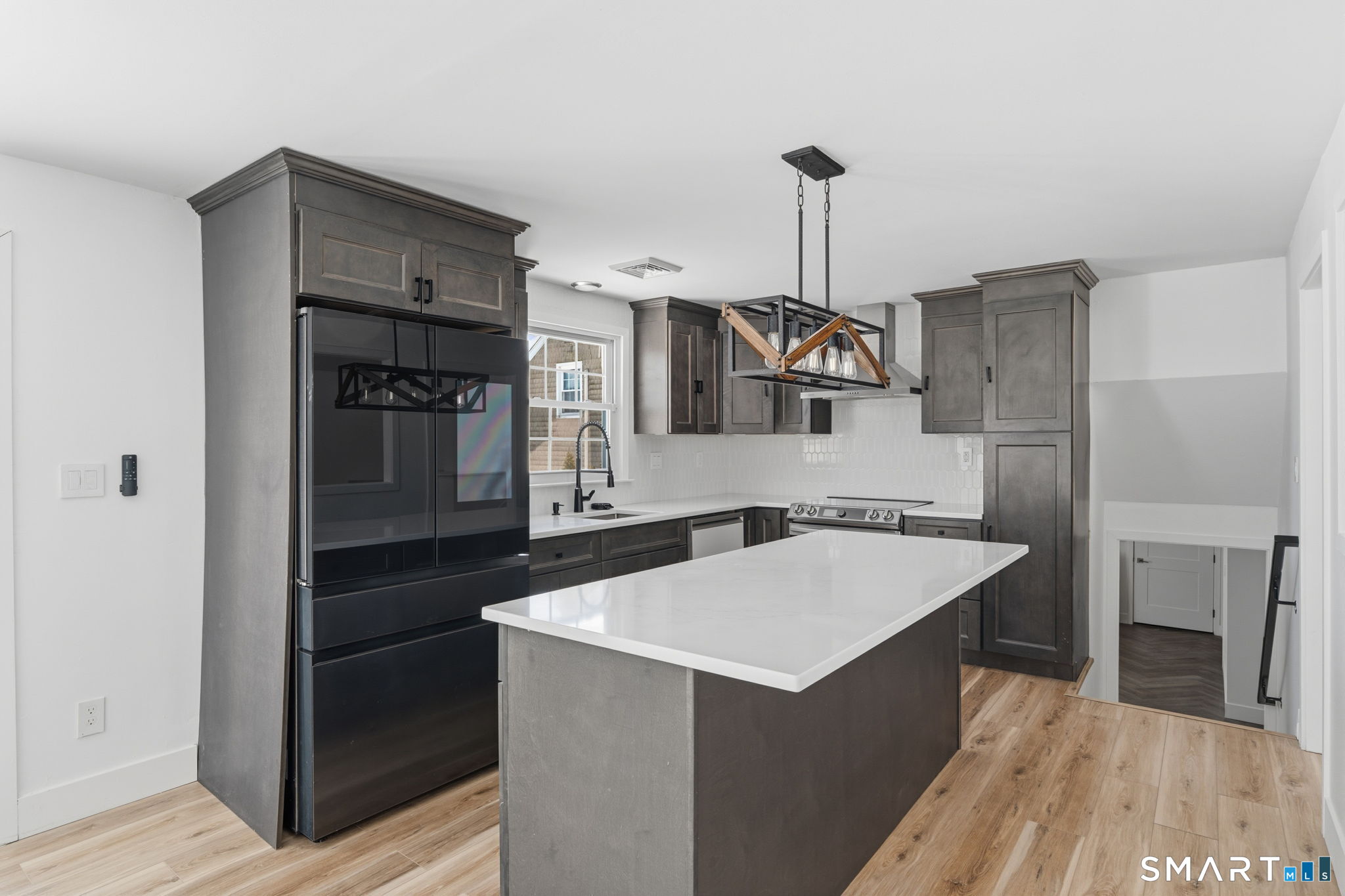 2 Yellow Orange Circle Middletown, CT 06457 - Photo 9 of 39 a kitchen with a sink refrigerator and cabinets