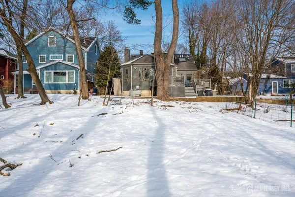 a view of a yard covered with snow