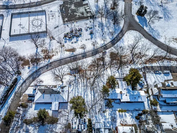 a view of a tall white building in the snow