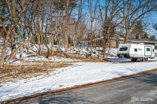 a view of a snow on the yard
