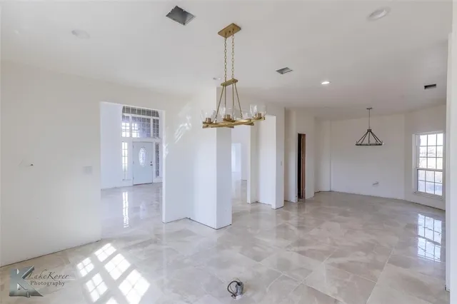 a view of empty room with windows