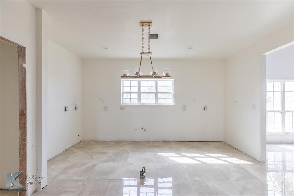 8773 West Lake Road Abilene, TX 79601 - Photo 13 of 40 a view of empty room with windows