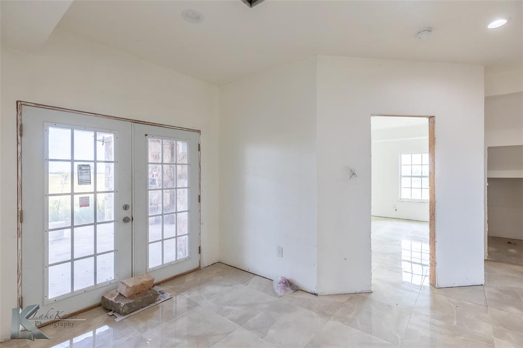 8773 West Lake Road Abilene, TX 79601 - Photo 14 of 40 an empty room with windows