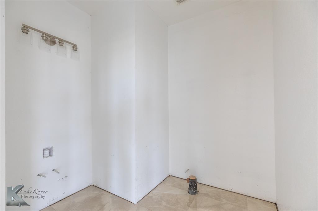 8773 West Lake Road Abilene, TX 79601 - Photo 15 of 40 a view of a closet in the bathroom