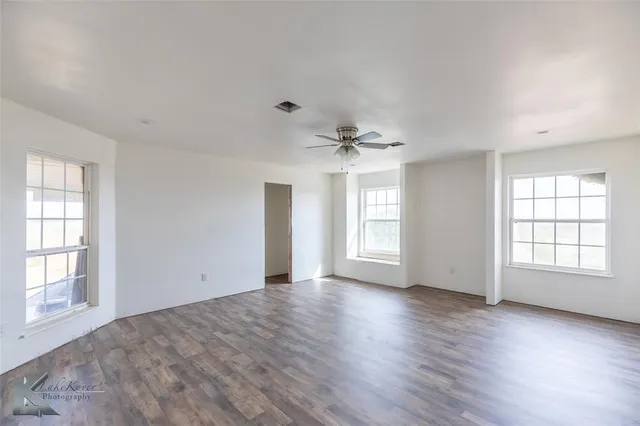 a view of a livingroom with furniture and a fireplace