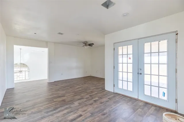 a view of an empty room and a window