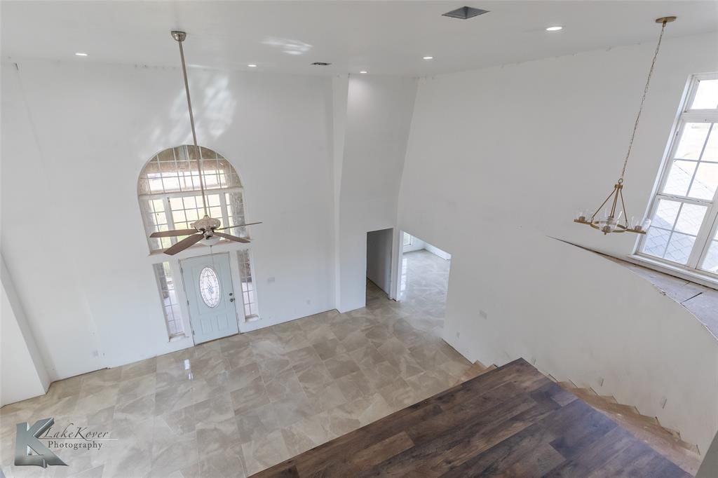 8773 West Lake Road Abilene, TX 79601 - Photo 30 of 40 a view of a room with wooden floor and staircase