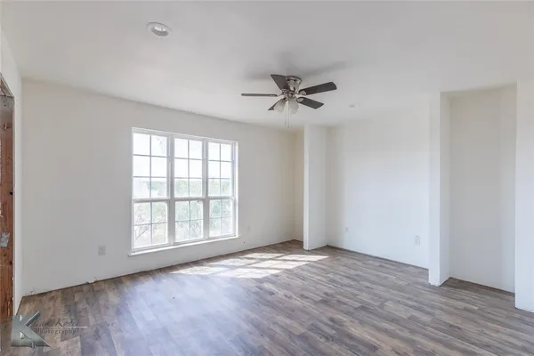 a view of a room with a large window