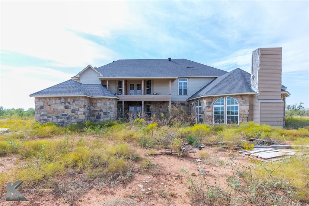 8773 West Lake Road Abilene, TX 79601 - Photo 38 of 40 a view of a house with backyard and sitting area