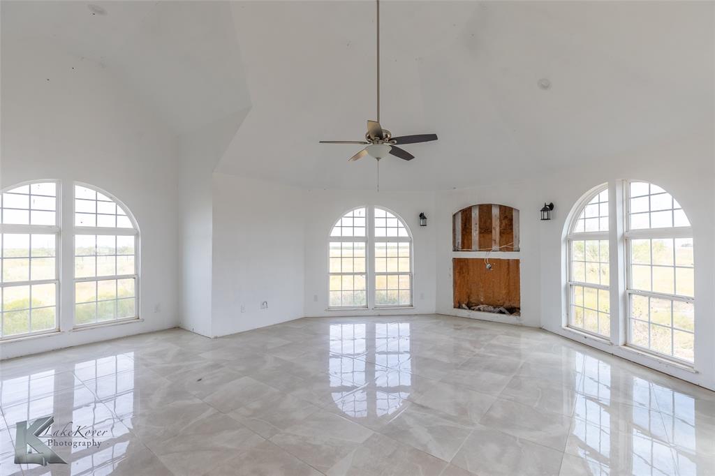 8773 West Lake Road Abilene, TX 79601 - Photo 4 of 40 a view of an empty room and window