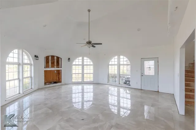 a view of empty room with windows