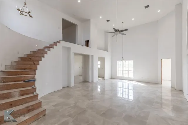 a view of an entryway with a front door and windows