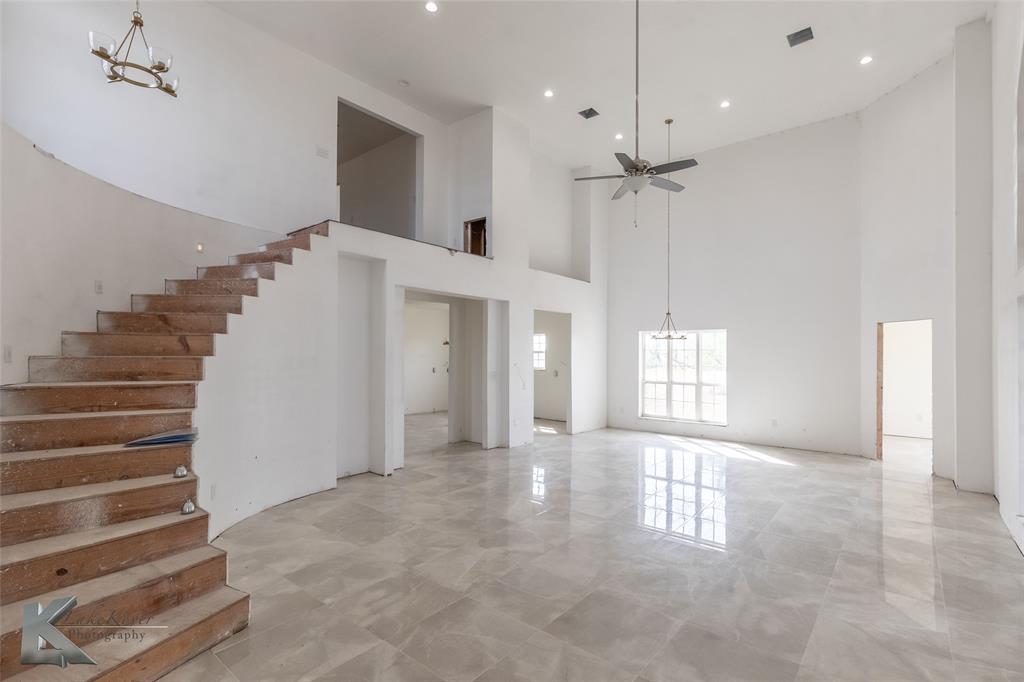 8773 West Lake Road Abilene, TX 79601 - Photo 6 of 40 a view of an entryway with a front door and windows