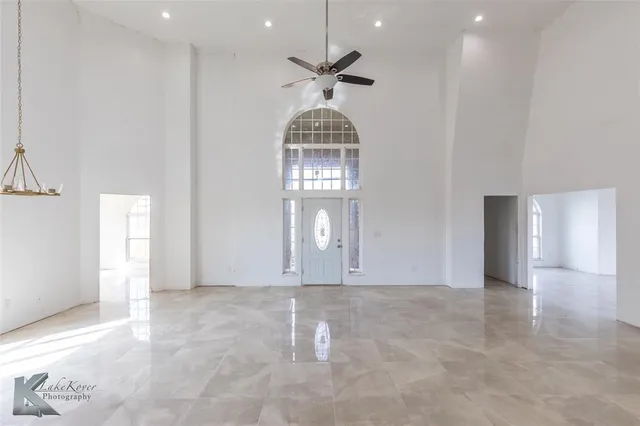 a view of empty room with windows