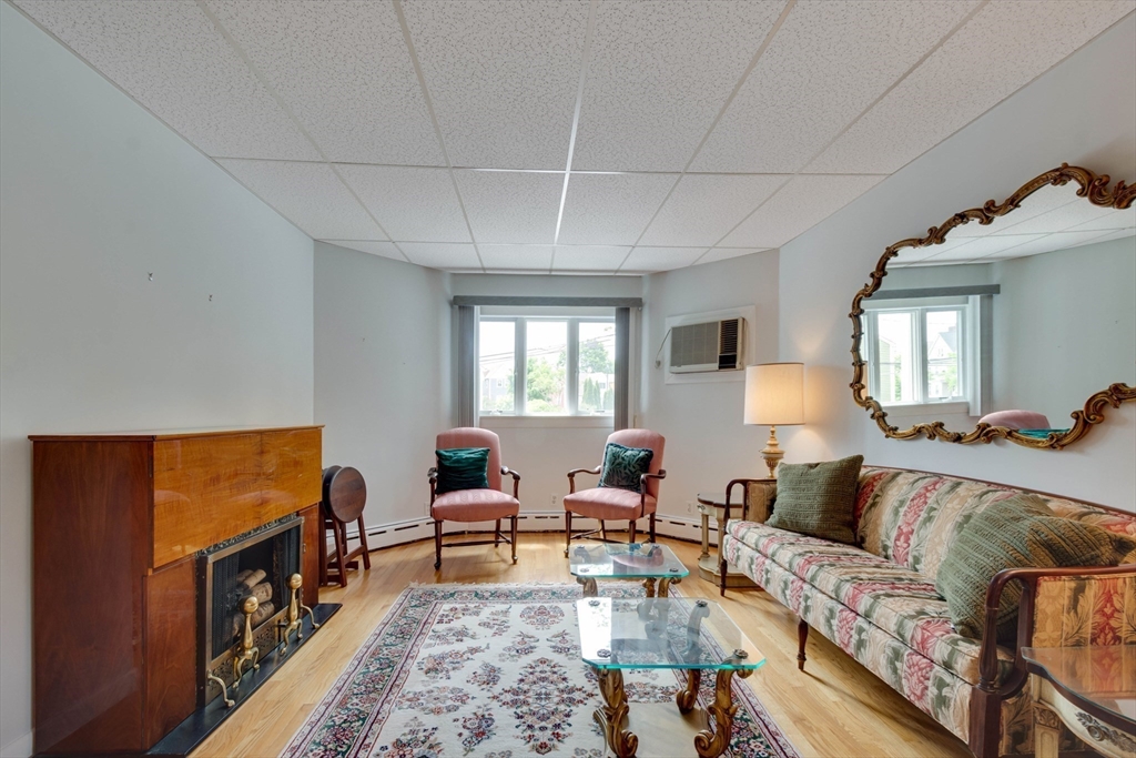 45 Jackson Road Somerville, MA 02145 - Photo 6 of 27 a living room with furniture and a flat screen tv