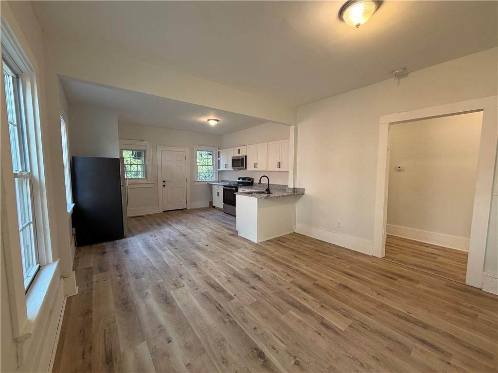 1026 Inverness Avenue Macon, GA 31204 - Photo 4 of 18 a kitchen with a refrigerator and a stove top oven